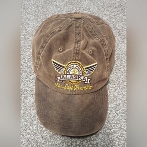 washed-cotton or "oil-rubbed" baseball cap featuring an embroidered Alaska Bush